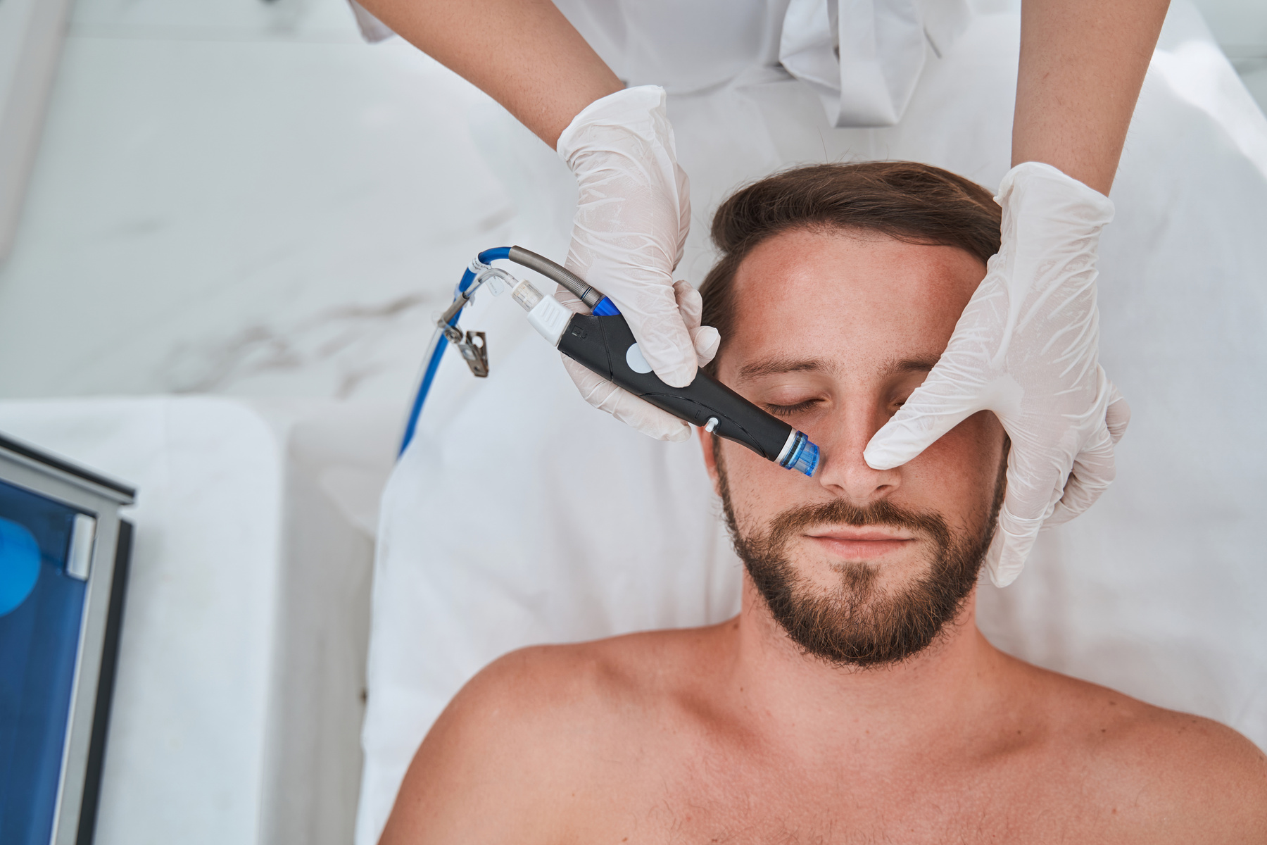 Beauty salon customer undergoing the hydrodermabrasion treatment